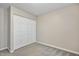 Cozy bedroom with a closet providing storage, carpeted floors, and neutral paint at 6927 Beaverwood Dr Dr, Raleigh, NC 27616