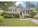 Charming home with a well-manicured lawn and inviting entrance at daytime at 6927 Beaverwood Dr Dr, Raleigh, NC 27616