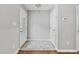Inviting foyer with tile flooring, hardwood trim, and fresh, neutral paint at 6927 Beaverwood Dr Dr, Raleigh, NC 27616