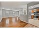 Open-concept living room features hardwood floors, neutral paint, and connects to the kitchen at 6927 Beaverwood Dr Dr, Raleigh, NC 27616