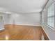 Spacious living room with hardwood floors, neutral paint, and natural light at 6927 Beaverwood Dr Dr, Raleigh, NC 27616