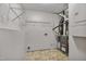 Functional utility room with storage shelves, tile floor, and equipment at 6927 Beaverwood Dr Dr, Raleigh, NC 27616
