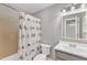 Bathroom featuring a decorative shower curtain, updated vanity, and neutral colors at 700 Bishops Park Dr # 302, Raleigh, NC 27605