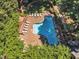 Well-maintained community pool area featuring lounge chairs and lush landscaping at 700 Bishops Park Dr # 302, Raleigh, NC 27605