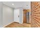 Cozy kitchenette area with stainless steel appliances, wood cabinets and brick accent wall at 700 Bishops Park Dr # 302, Raleigh, NC 27605