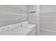 Bright laundry room featuring white appliances and wire shelving at 700 Bishops Park Dr # 302, Raleigh, NC 27605