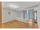 Open-plan living area with hardwood floors, a fireplace, and sliding glass doors to outdoor space at 700 Bishops Park Dr # 302, Raleigh, NC 27605