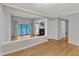 Bright living area with hardwood floors, fireplace, and sliding doors to a balcony with green views at 700 Bishops Park Dr # 302, Raleigh, NC 27605