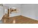 Spacious living area with hardwood floors, fireplace, and partial views of the kitchen and entryway at 700 Bishops Park Dr # 302, Raleigh, NC 27605