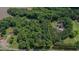 An aerial view showcasing the expansive lot with lush greenery and waterfront access at 7483 Danford Rd, Burlington, NC 27215