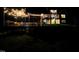 Backyard at night with an in-ground pool and a patio with overhead string lights creating a warm ambiance at 7483 Danford Rd, Burlington, NC 27215