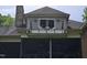Upper balcony overlooking the screen porch featuring seating and iron railing at 7483 Danford Rd, Burlington, NC 27215