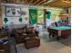 Finished basement with pool table, bar, and comfortable seating area at 7483 Danford Rd, Burlington, NC 27215