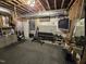 Basement gym space with weight rack, equipment, and unfinished ceiling at 7483 Danford Rd, Burlington, NC 27215