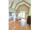 Elegant dining room with hardwood floors, a chandelier, and a large window at 7483 Danford Rd, Burlington, NC 27215
