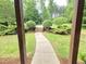 Inviting walkway to the front entrance, framed by well-manicured landscaping at 7483 Danford Rd, Burlington, NC 27215