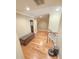 Bright hallway features hardwood floors, natural light, and leads to a bathroom on the second floor at 7483 Danford Rd, Burlington, NC 27215