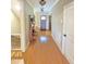 Inviting hallway with hardwood floors, stylish lighting, and access to various rooms at 7483 Danford Rd, Burlington, NC 27215