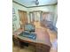 Home office with wood floors, desk, and antique secretary desk at 7483 Danford Rd, Burlington, NC 27215
