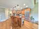 Bright kitchen with custom wood island, hardwood floors, stainless steel appliances and recessed lighting at 7483 Danford Rd, Burlington, NC 27215