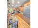 Spacious kitchen with granite countertops, stainless steel appliances, and natural wood floors at 7483 Danford Rd, Burlington, NC 27215