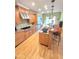 Well-equipped kitchen features a chef-grade range, stainless steel appliances, custom cabinets, and a large island at 7483 Danford Rd, Burlington, NC 27215