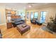 Cozy living room with an open floor plan, hardwood flooring and a wood burning fireplace at 7483 Danford Rd, Burlington, NC 27215