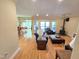 Open living room featuring hardwood floors, fireplace, and access to the back patio with great views at 7483 Danford Rd, Burlington, NC 27215