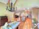 Open concept living and dining areas featuring hardwood floors, modern lighting and an expansive view at 7483 Danford Rd, Burlington, NC 27215