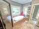 Bright bathroom featuring a soaking tub with a large window, a shower, and tile floors at 7483 Danford Rd, Burlington, NC 27215
