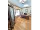 Home office featuring hardwood floors, natural light, and a beautiful stained glass door at 7483 Danford Rd, Burlington, NC 27215
