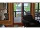 Beautiful lake view from the living area featuring a screened in porch and peaceful natural setting at 7483 Danford Rd, Burlington, NC 27215