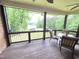 Relax on the screened-in porch with a lovely view of the lake and surrounding greenery at 7483 Danford Rd, Burlington, NC 27215