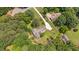 Aerial view of a home with a long driveway surrounded by trees at 8133 Holly Forest Rd, Wake Forest, NC 27587