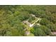 Aerial view of the home and grounds, highlighting the large lot with mature trees at 8133 Holly Forest Rd, Wake Forest, NC 27587