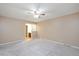 Bedroom with neutral carpet, ceiling fan, and access to an en suite bathroom at 8133 Holly Forest Rd, Wake Forest, NC 27587