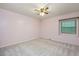 Carpeted bedroom with ceiling fan and double hung windows at 8133 Holly Forest Rd, Wake Forest, NC 27587