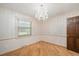 Elegant dining room featuring hardwood floors and a stylish chandelier at 8133 Holly Forest Rd, Wake Forest, NC 27587
