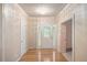 Welcoming entryway featuring hardwood floors and decorative door at 8133 Holly Forest Rd, Wake Forest, NC 27587