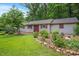 Cozy outbuilding exterior with green grass and landscaping at 8133 Holly Forest Rd, Wake Forest, NC 27587