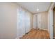 Bright hallway with neutral walls and a white door leading to the exterior at 8133 Holly Forest Rd, Wake Forest, NC 27587