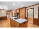 Open kitchen featuring hardwood floors and stainless steel appliances at 8133 Holly Forest Rd, Wake Forest, NC 27587