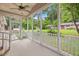 Screened in porch with railings overlooking lawn and yard at 8133 Holly Forest Rd, Wake Forest, NC 27587