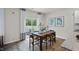 Open dining area with natural light from sliding glass doors and a view of outdoor living at 818 Comice Pear Way, Willow Springs, NC 27592