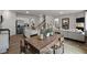 Open-concept dining area with a view of the kitchen and living room for easy entertaining and comfortable living at 818 Comice Pear Way, Willow Springs, NC 27592