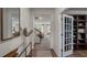 Inviting entryway with hardwood floors that leads into the living spaces with a decorative glass door at 818 Comice Pear Way, Willow Springs, NC 27592