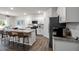 Modern kitchen with granite countertops, stainless steel appliances, and a center island with seating at 818 Comice Pear Way, Willow Springs, NC 27592