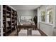 Stylish home office with built-in bookshelves, a large window, and neutral decor at 818 Comice Pear Way, Willow Springs, NC 27592