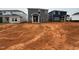View of the home's backyard, featuring a gray exterior and a sliding glass door at 829 Ottawa Dr, Garner, NC 27529