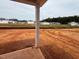 Open backyard with construction and green spaces at 829 Ottawa Dr, Garner, NC 27529